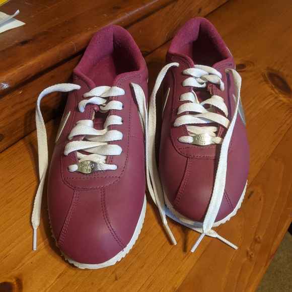 Like new Nike sneakers..these are raspberry with a metallic Nike stripe. - Picture 2 of 3